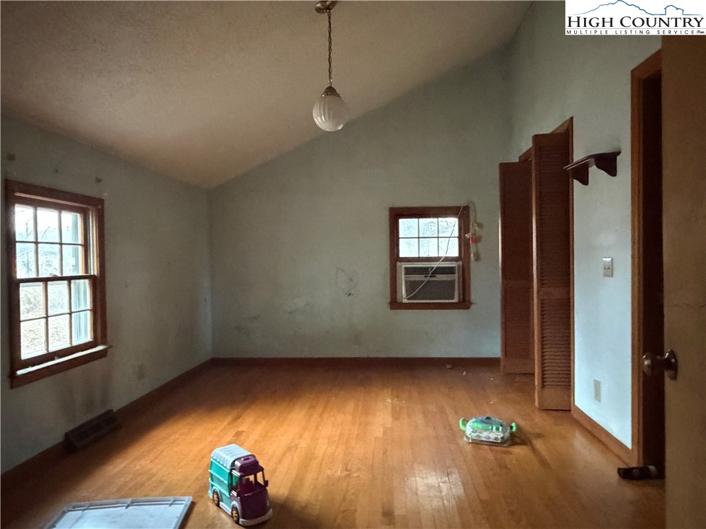 1630 Pleasant Ridge Road State Road, NC 28676 - Photo 10 of 17 a view of empty room with wooden floor and fan