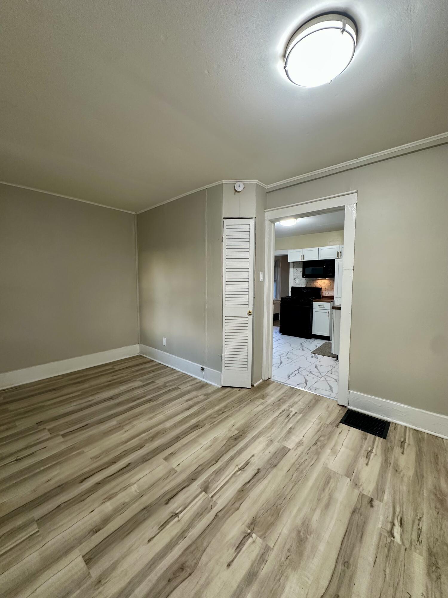 6244 Madison Avenue Hammond, IN 46324 - Photo 14 of 21 a view of empty room with wooden floor