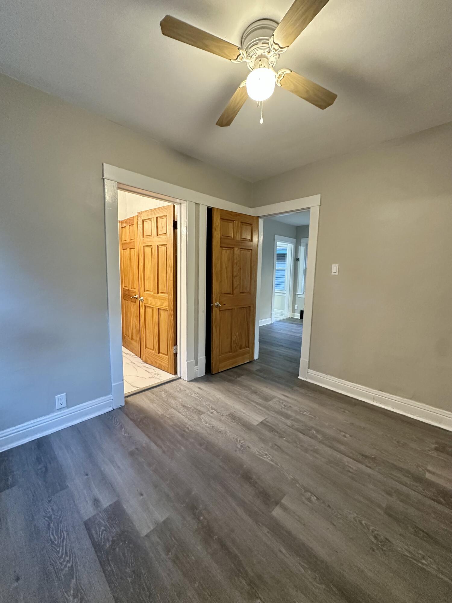 6244 Madison Avenue Hammond, IN 46324 - Photo 6 of 21 wooden floor in an empty room with a window