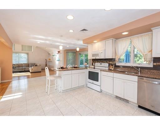 4 Rivers Lane Stoneham, MA 02180 - Photo 13 of 42 a large white kitchen with a large window