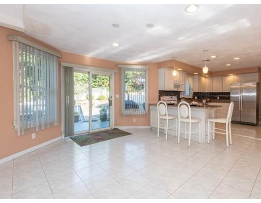4 Rivers Lane Stoneham, MA 02180 - Photo 15 of 42 a view of a kitchen with dining table and chairs