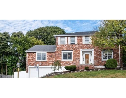4 Rivers Lane Stoneham, MA 02180 - Photo 2 of 42 a front view of a house with a yard