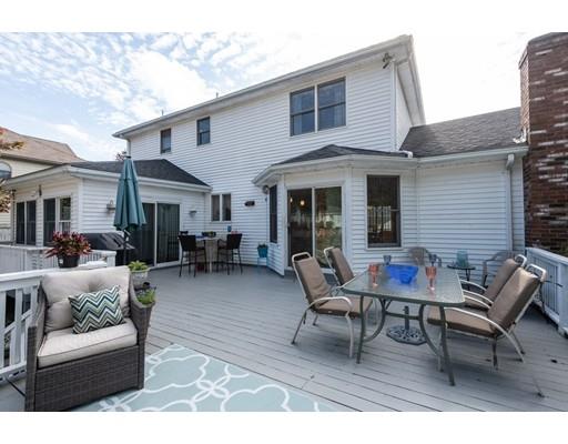 4 Rivers Lane Stoneham, MA 02180 - Photo 21 of 42 a backyard of a house with seating space