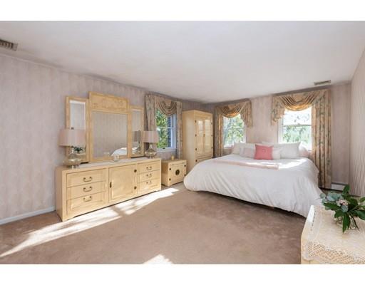 4 Rivers Lane Stoneham, MA 02180 - Photo 24 of 42 a spacious bedroom with a bed and a dresser
