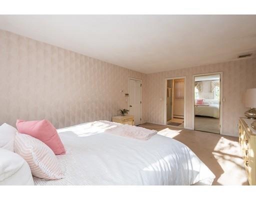 4 Rivers Lane Stoneham, MA 02180 - Photo 25 of 42 a bedroom with a bed and a mirror