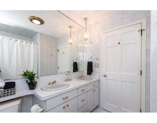 4 Rivers Lane Stoneham, MA 02180 - Photo 30 of 42 a bathroom with a sink vanity granite tub shower and a mirror