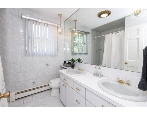 4 Rivers Lane Stoneham, MA 02180 - Photo 31 of 42 a bathroom with a sink a toilet and shower