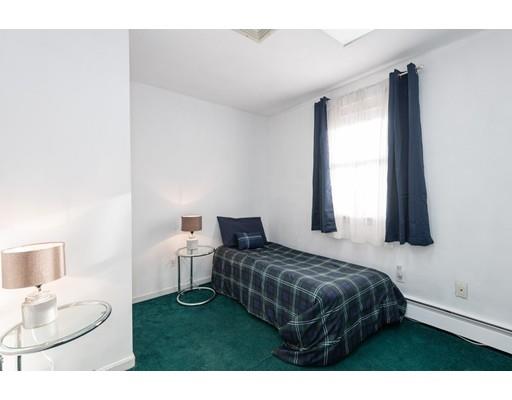 4 Rivers Lane Stoneham, MA 02180 - Photo 34 of 42 a bedroom with a bed and a window