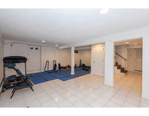 4 Rivers Lane Stoneham, MA 02180 - Photo 36 of 42 a view of a livingroom with furniture and a gym equipment