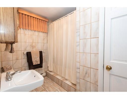 4 Rivers Lane Stoneham, MA 02180 - Photo 37 of 42 a bathroom with a sink and a mirror