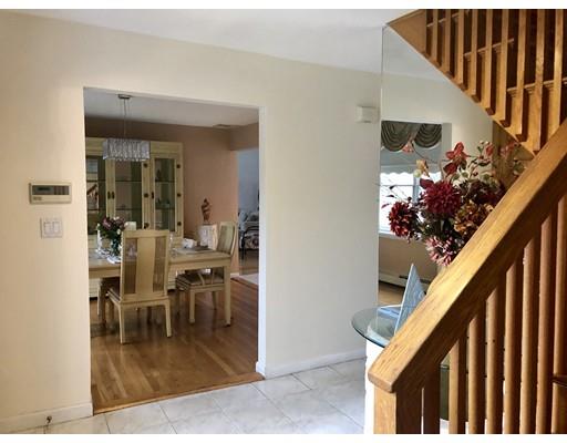 4 Rivers Lane Stoneham, MA 02180 - Photo 5 of 42 a dining room with furniture potted plants and wooden floor