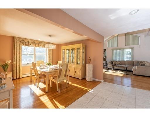 4 Rivers Lane Stoneham, MA 02180 - Photo 8 of 42 a dining room with wooden floor and large window