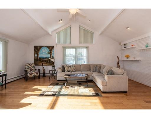 4 Rivers Lane Stoneham, MA 02180 - Photo 9 of 42 a living room with furniture and a flat screen tv