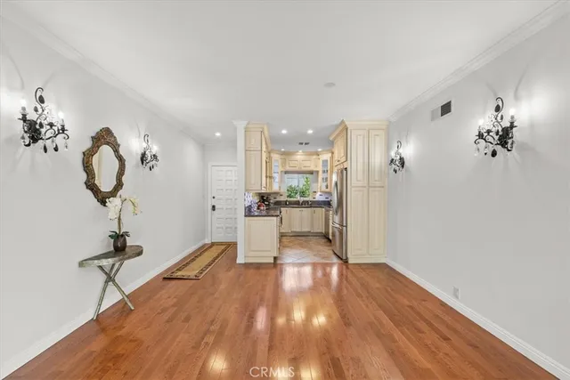 a kitchen with stainless steel appliances granite countertop a refrigerator and a stove