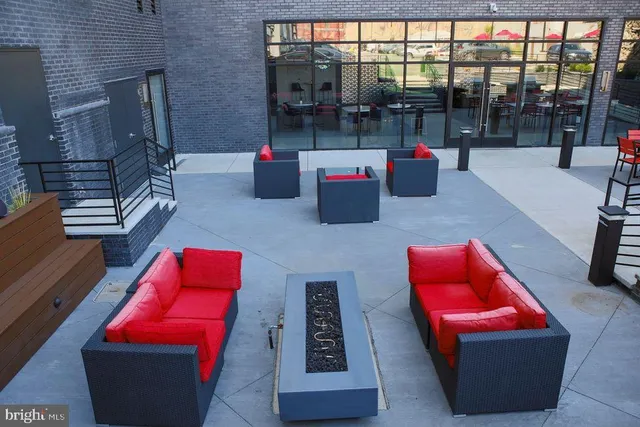 a view of a chairs and a table in the patio