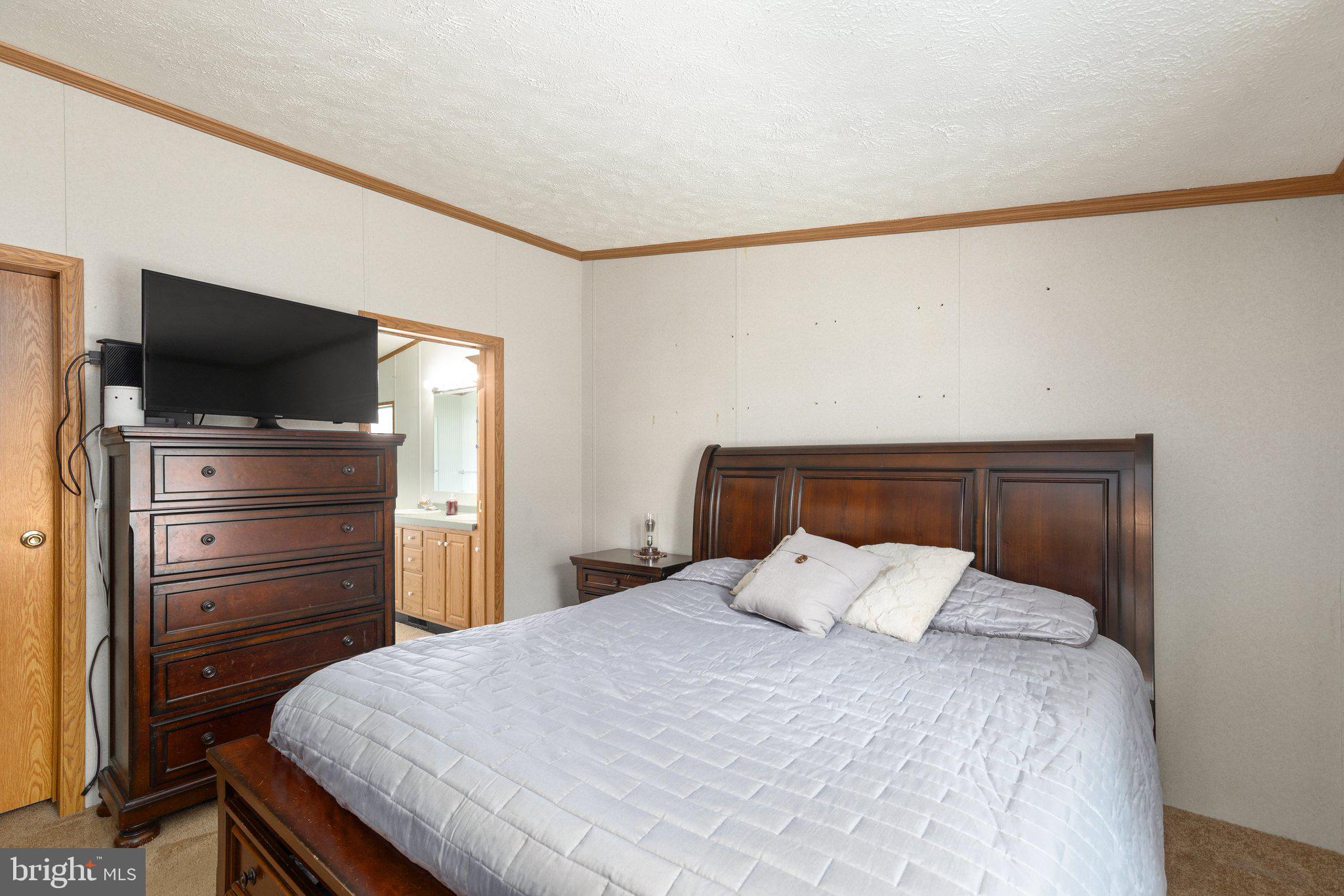 4041 Conowingo Road, Unit 29A Darlington, MD 21034 - Photo 11 of 21 a bed room with a bed and television