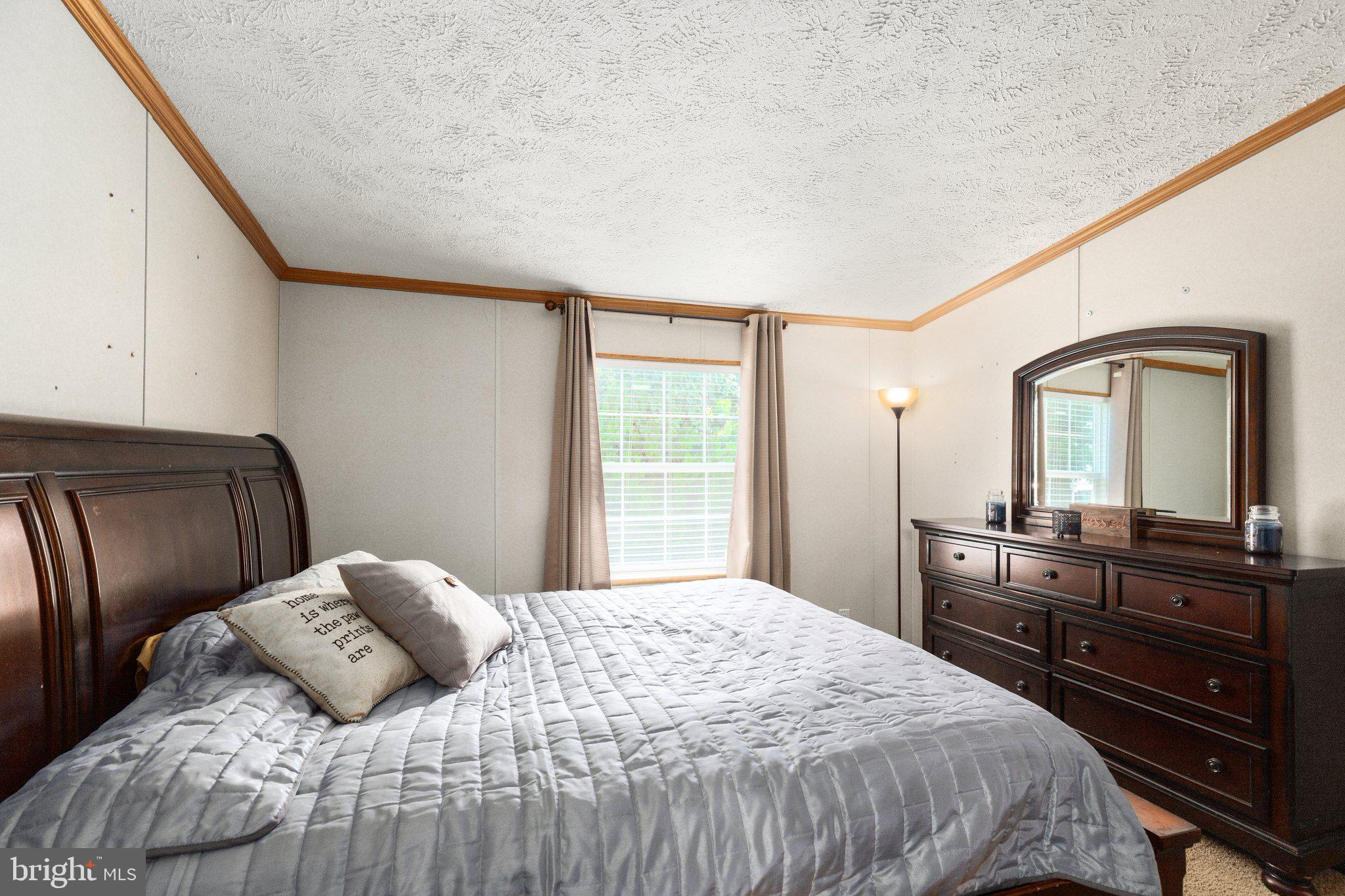4041 Conowingo Road, Unit 29A Darlington, MD 21034 - Photo 12 of 21 a bedroom with a bed and a dresser with mirror