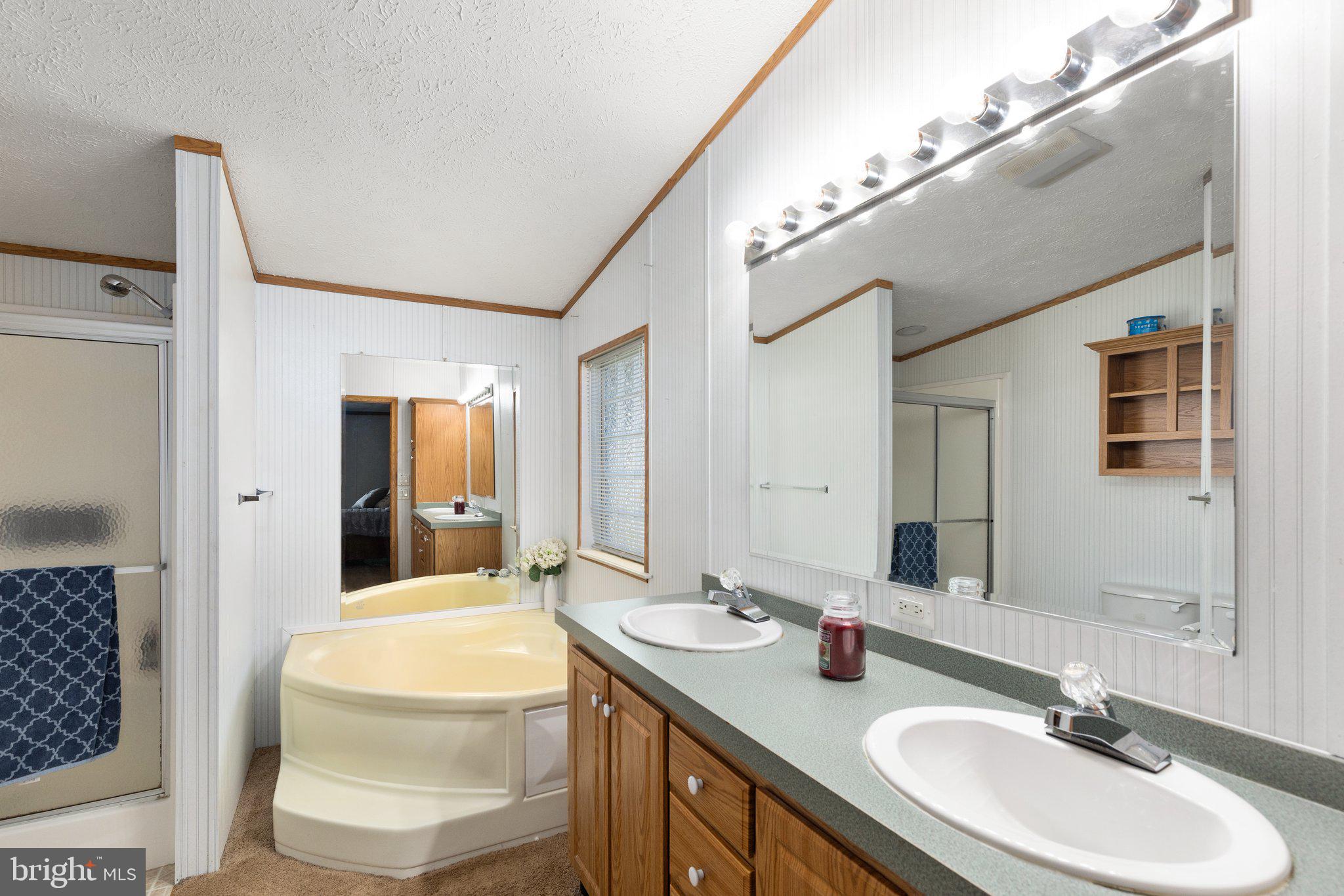 4041 Conowingo Road, Unit 29A Darlington, MD 21034 - Photo 13 of 21 a bathroom with a sink double vanity and a mirror