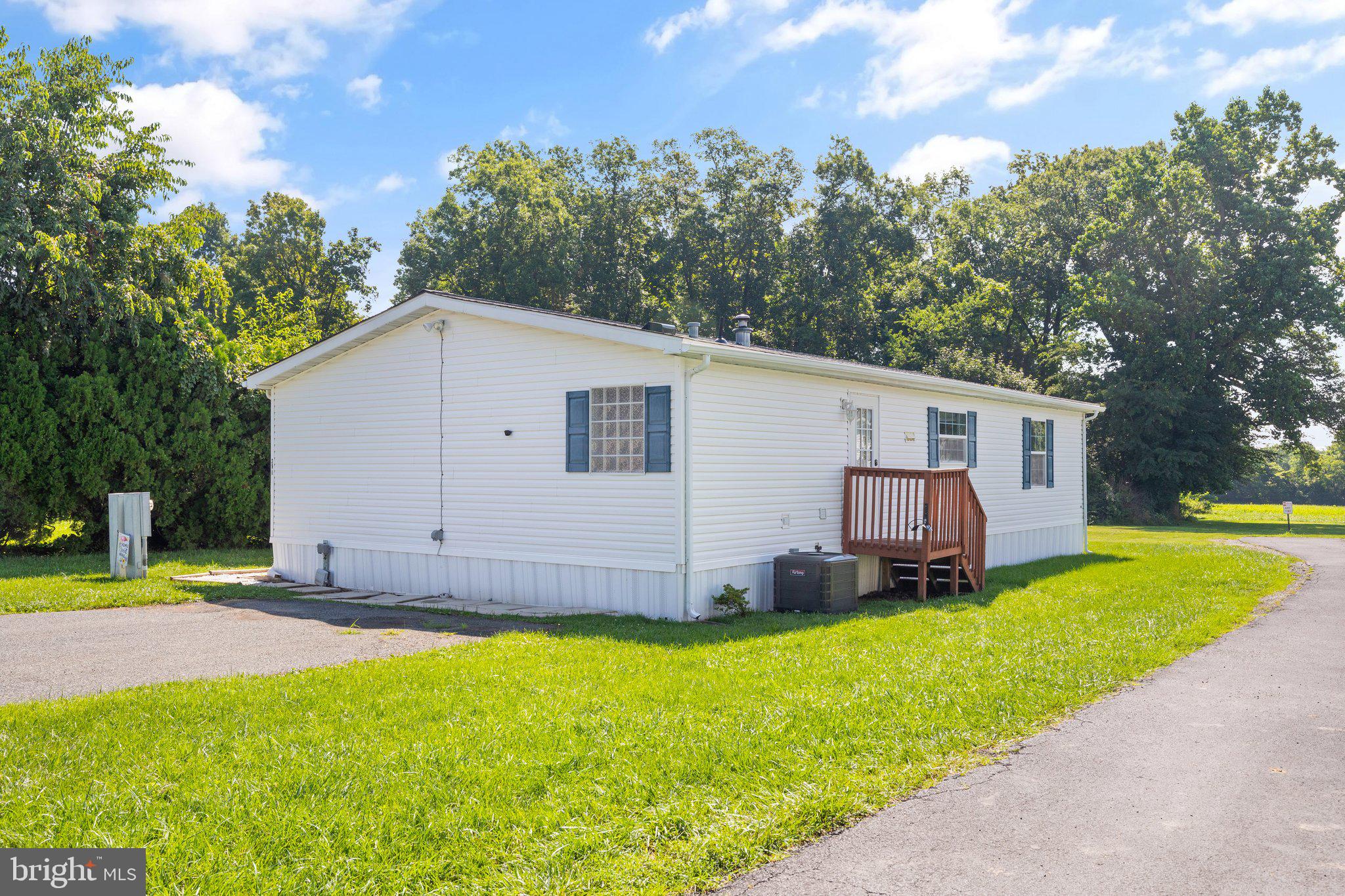 4041 Conowingo Road, Unit 29A Darlington, MD 21034 - Photo 3 of 21 a view of a white house with a big yard