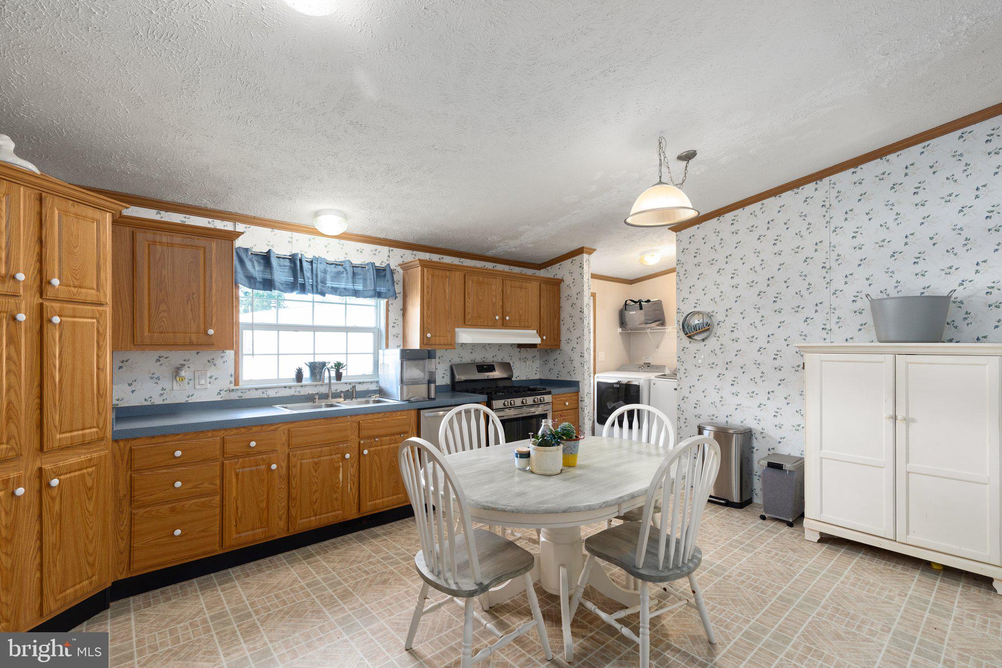4041 Conowingo Road, Unit 29A Darlington, MD 21034 - Photo 7 of 21 a kitchen with granite countertop a sink and a refrigerator