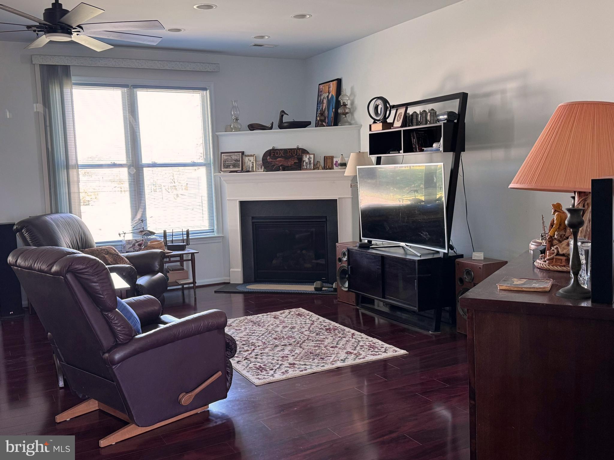 14137 Cedar Run Road Culpeper, VA 22701 - Photo 15 of 30 a living room with furniture a flat screen tv and a fireplace
