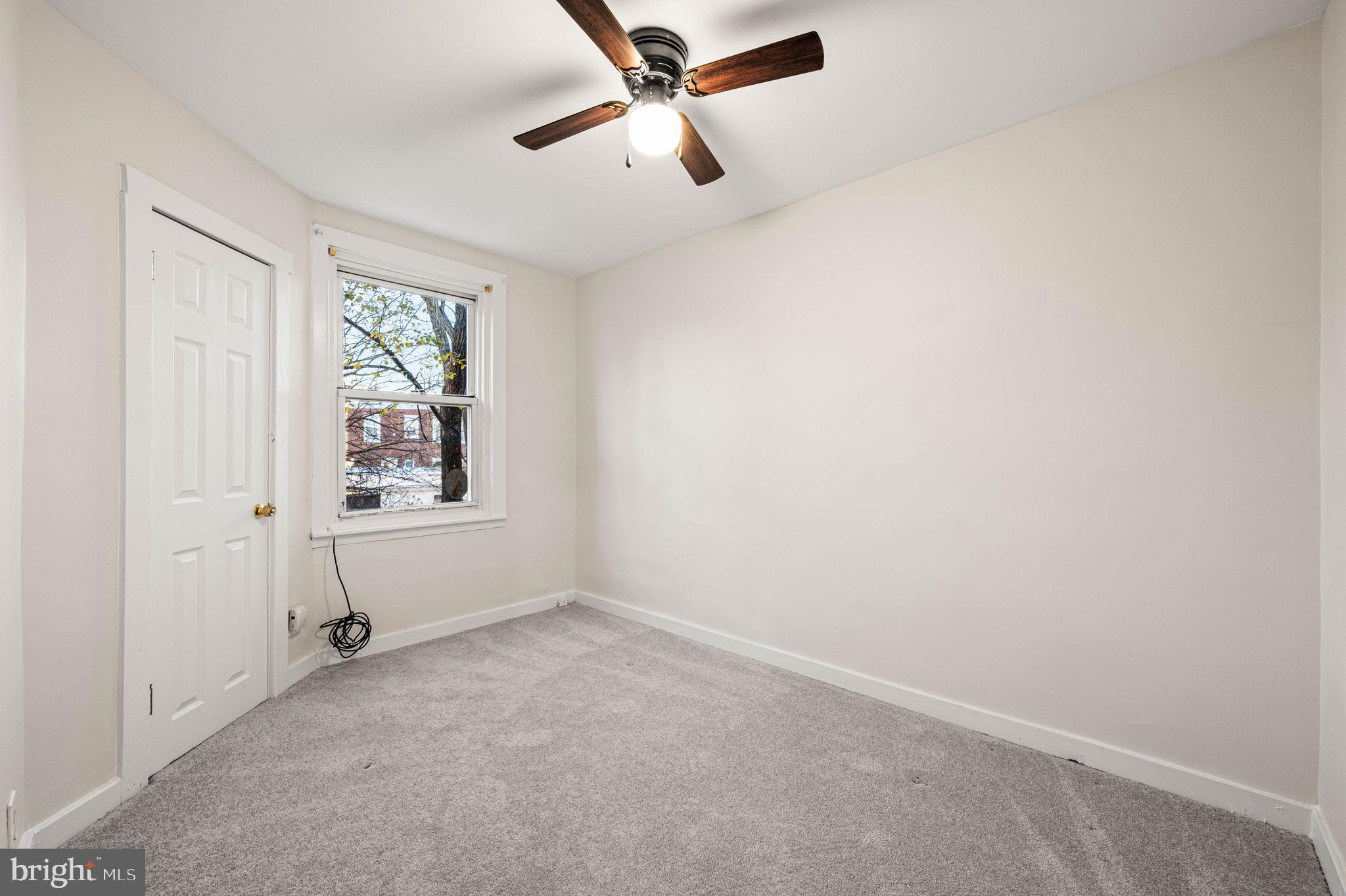 7113 Theodore Street Philadelphia, PA 19142 - Photo 15 of 26 an empty room with windows and fan