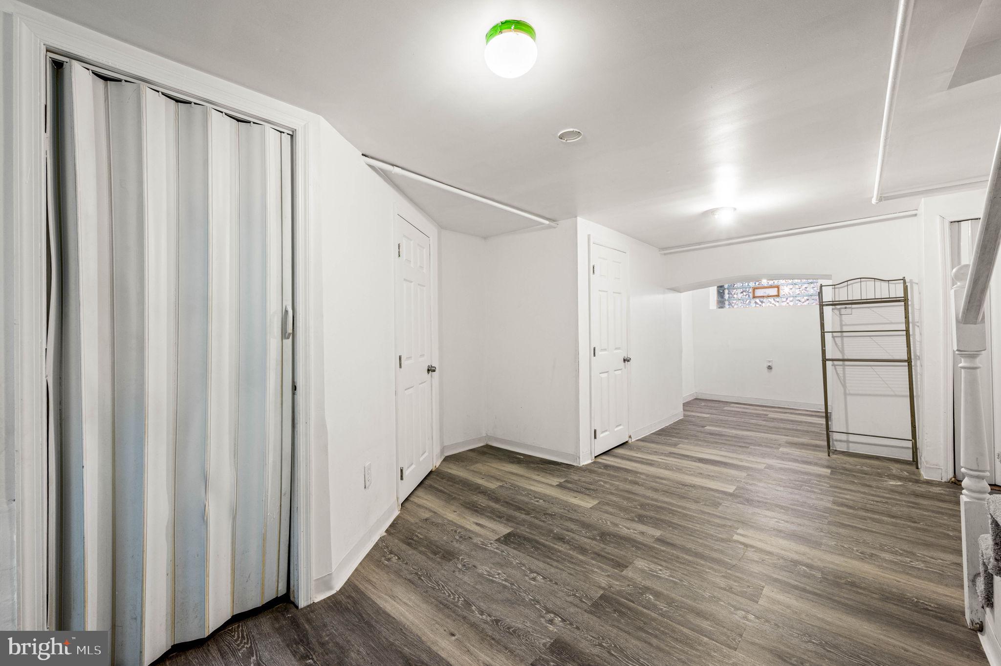 7113 Theodore Street Philadelphia, PA 19142 - Photo 20 of 26 a view of a hallway with wooden floor and staircase