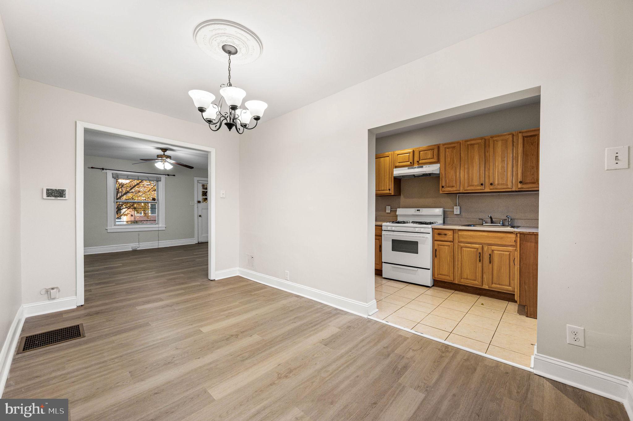 7113 Theodore Street Philadelphia, PA 19142 - Photo 2 of 26 a view of kitchen with a sink cabinets and wooden floor