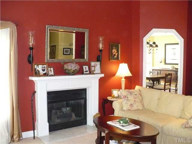 239 Fox Pen Drive Raleigh, NC 27603 - Photo 2 of 9 Spacious and comfortable living room with fireplace.