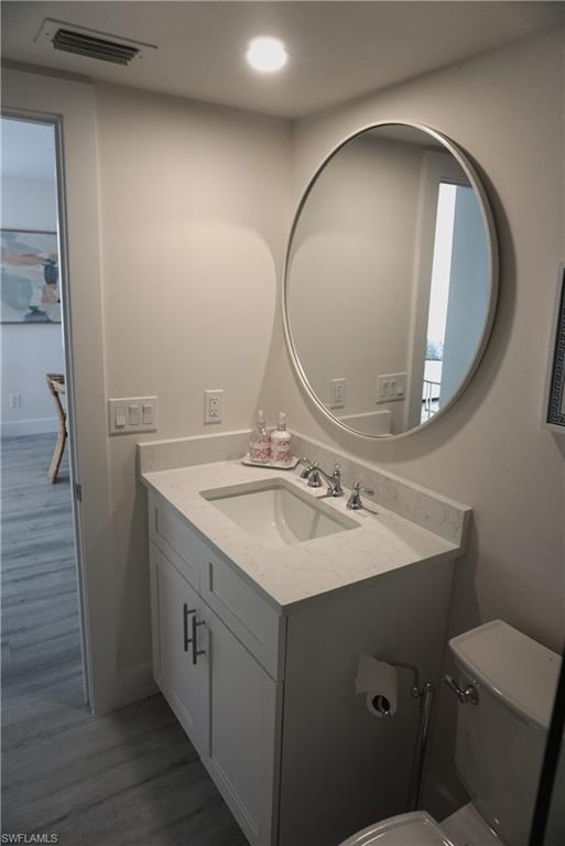 663 12th Avenue South, Unit 663 Naples, FL 34102 - Photo 13 of 14 a bathroom with a sink and a mirror