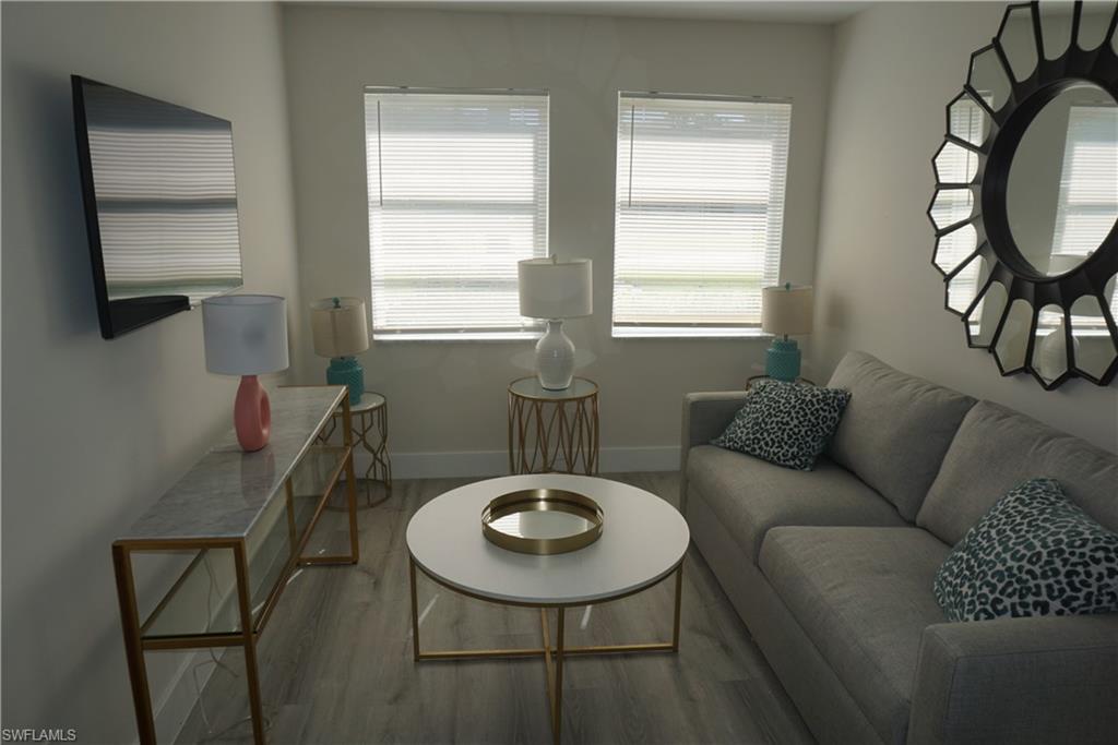 663 12th Avenue South, Unit 663 Naples, FL 34102 - Photo 7 of 14 a living room with furniture and a window