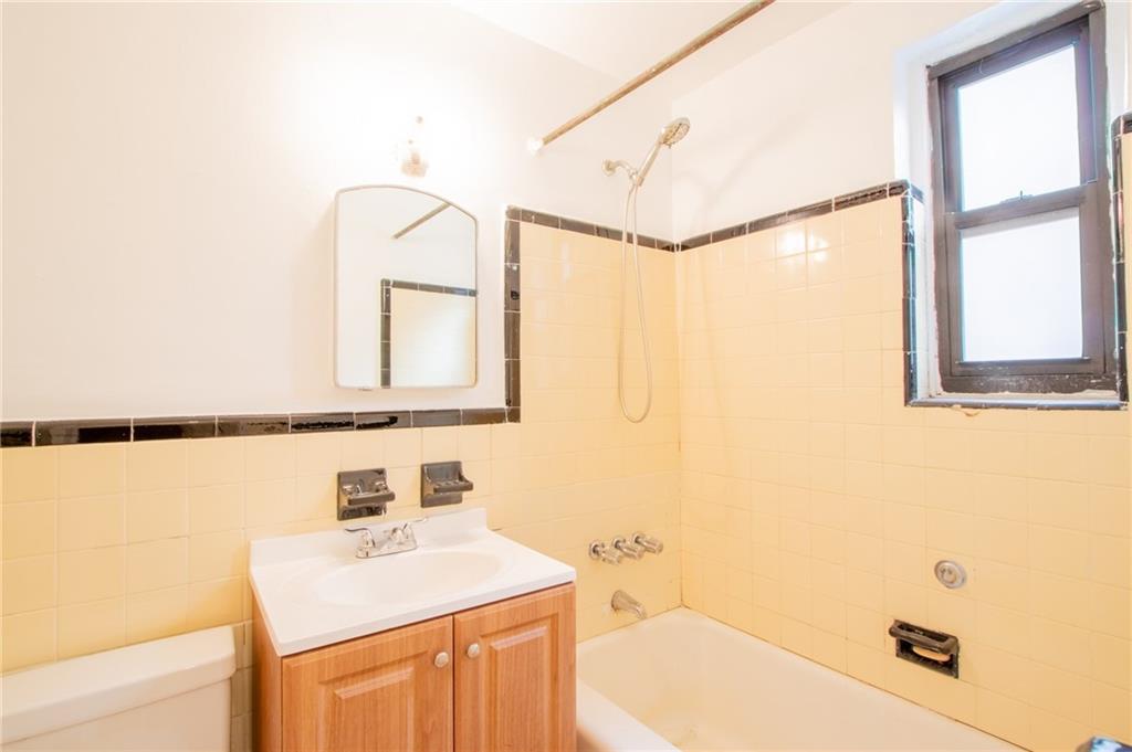 35 Oliver Street, Unit 1D Brooklyn, NY 11209 - Photo 11 of 23 a bathroom with a sink and a mirror