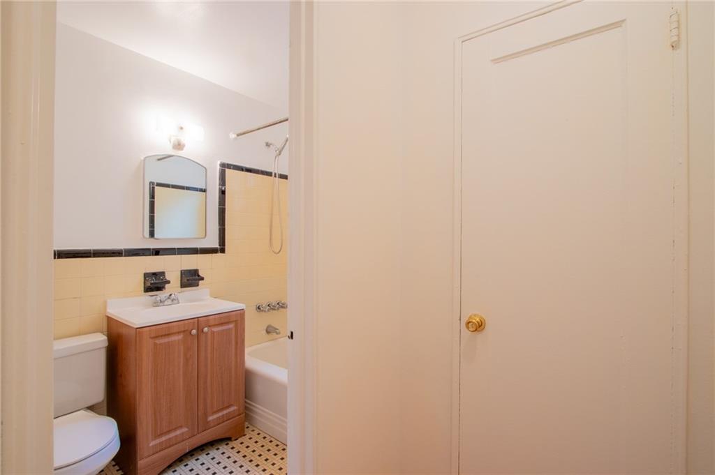 35 Oliver Street, Unit 1D Brooklyn, NY 11209 - Photo 12 of 23 a bathroom with a sink toilet and mirror
