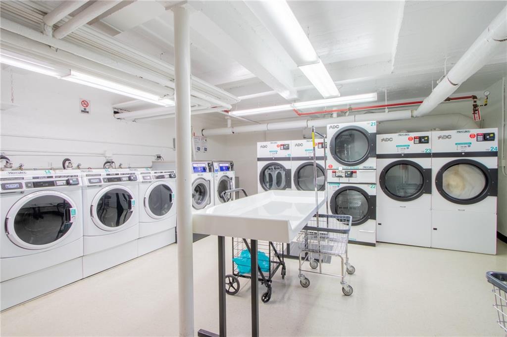 35 Oliver Street, Unit 1D Brooklyn, NY 11209 - Photo 18 of 23 a utility room with dryer washer and a view of living room