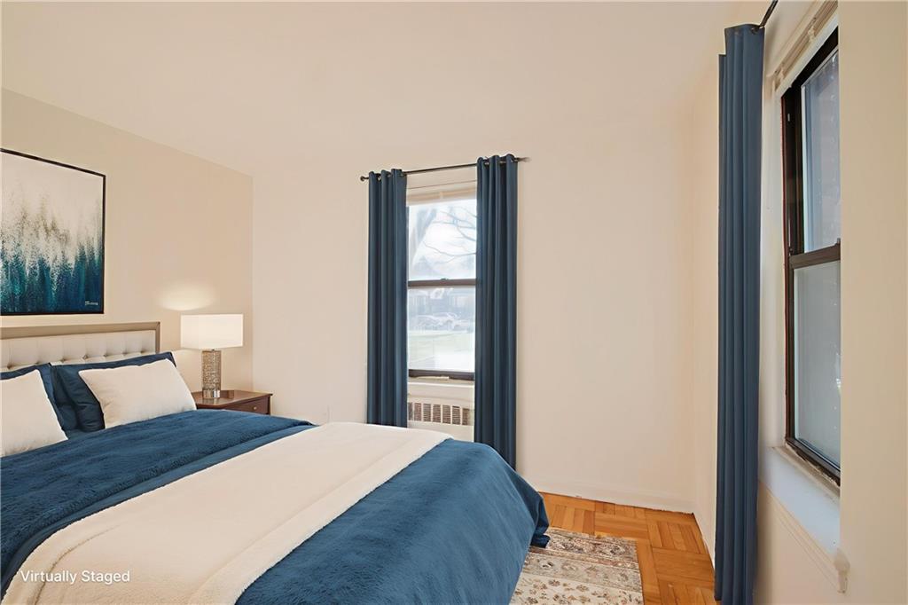 35 Oliver Street, Unit 1D Brooklyn, NY 11209 - Photo 6 of 23 a bedroom with a bed and a window