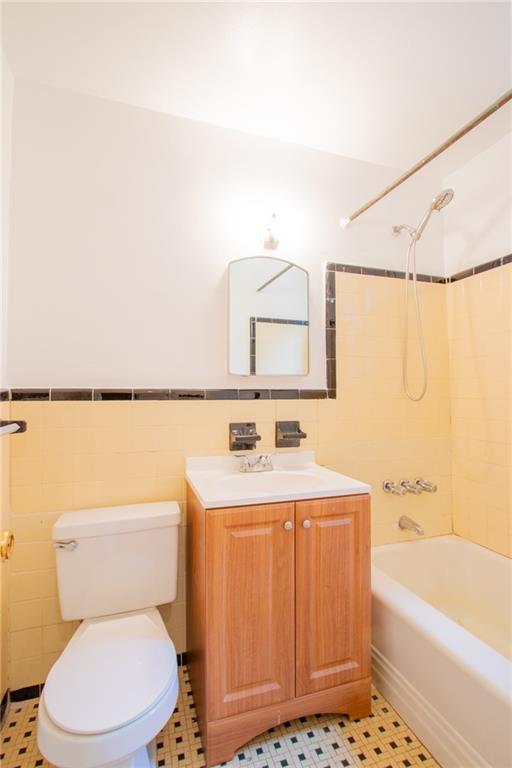 35 Oliver Street, Unit 1D Brooklyn, NY 11209 - Photo 10 of 23 a bathroom with a sink a toilet and shower