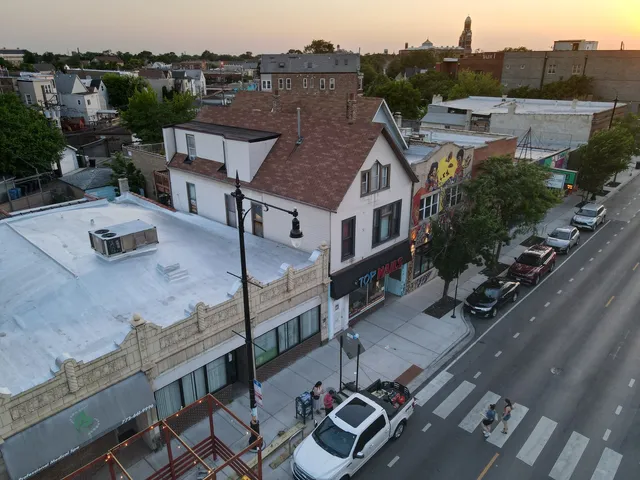 an aerial view of a house with a garden