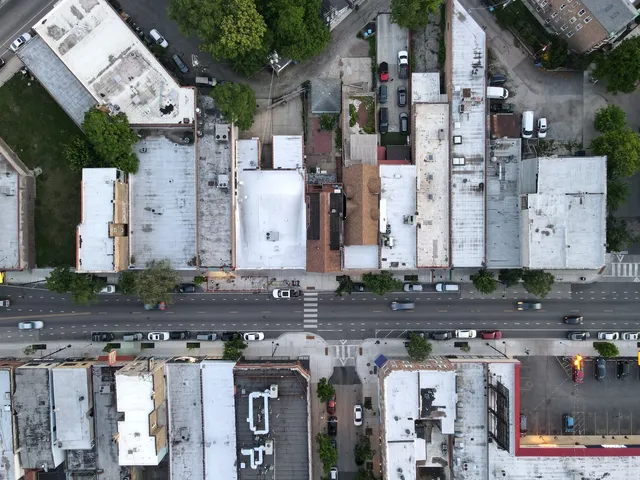 a city street filled with lots of tall buildings