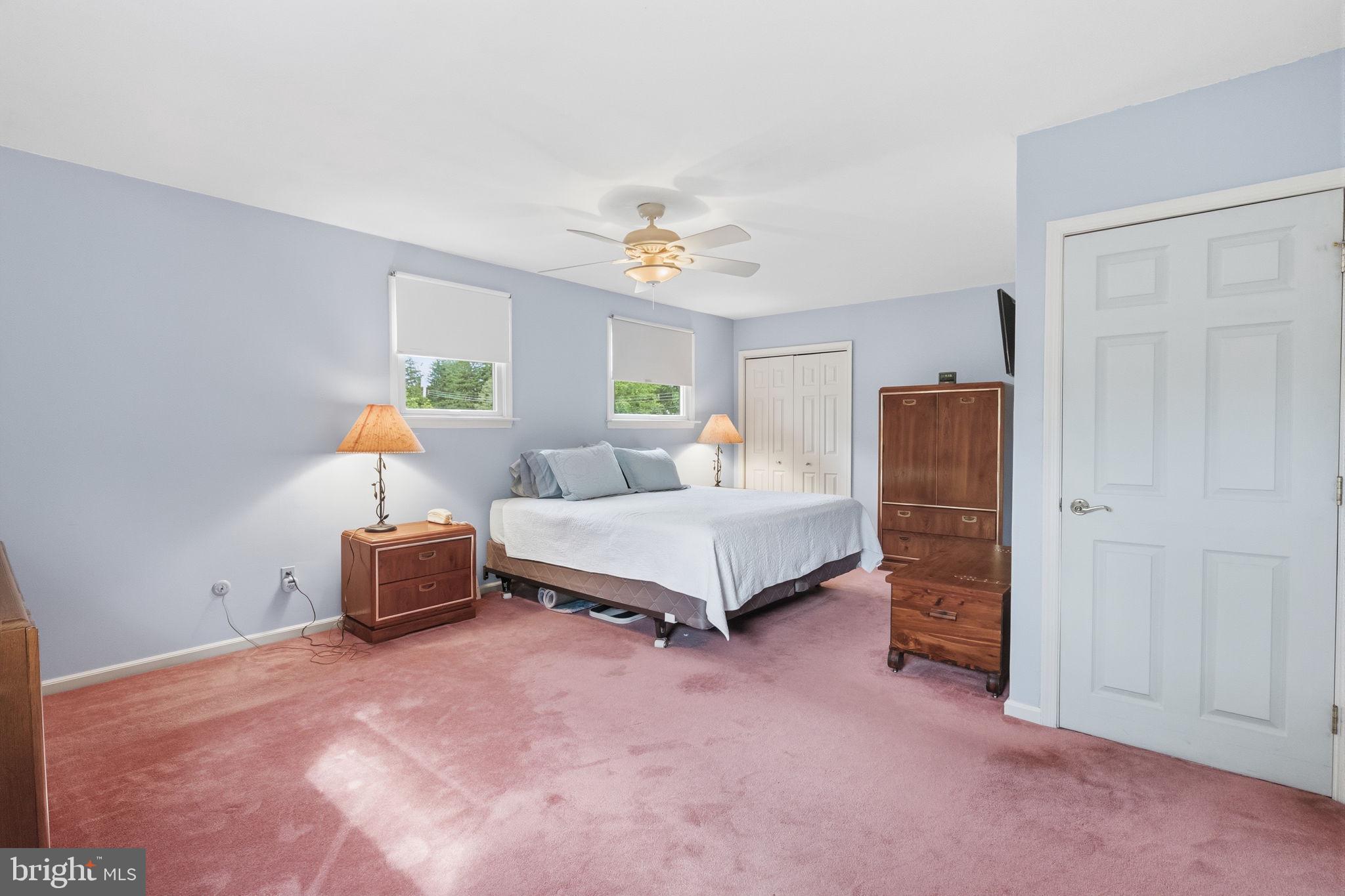 81 Cherokee Road Doylestown, PA 18901 - Photo 18 of 43 a bedroom with a bed and a chandelier