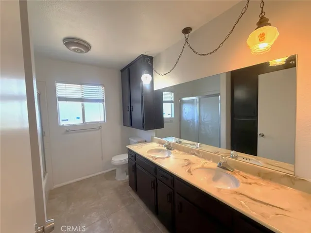 a bathroom with a glass shower door