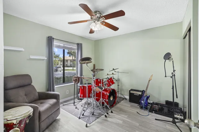 a living room with furniture stairs and a window