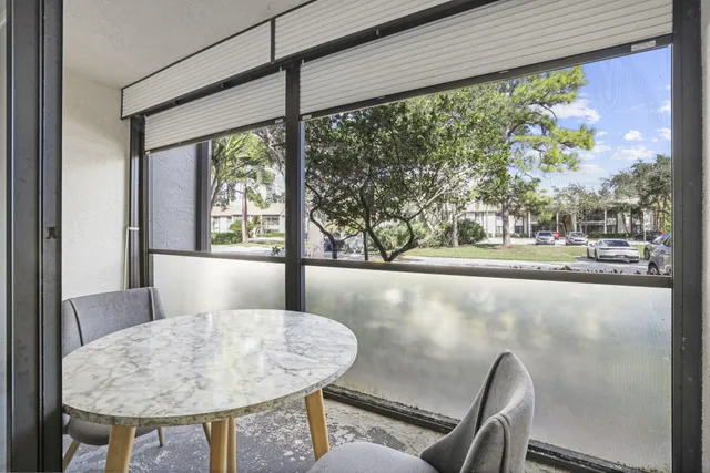a view of a dining room with furniture window and outside view