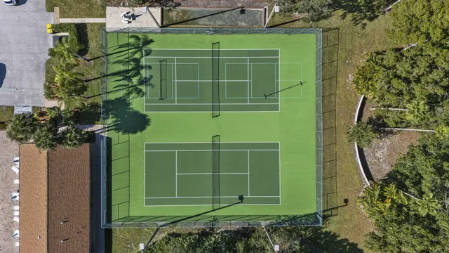 an aerial view of residential houses with outdoor space