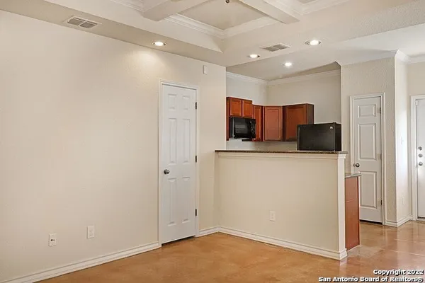 a view of a kitchen with a sink and dishwasher wooden floor