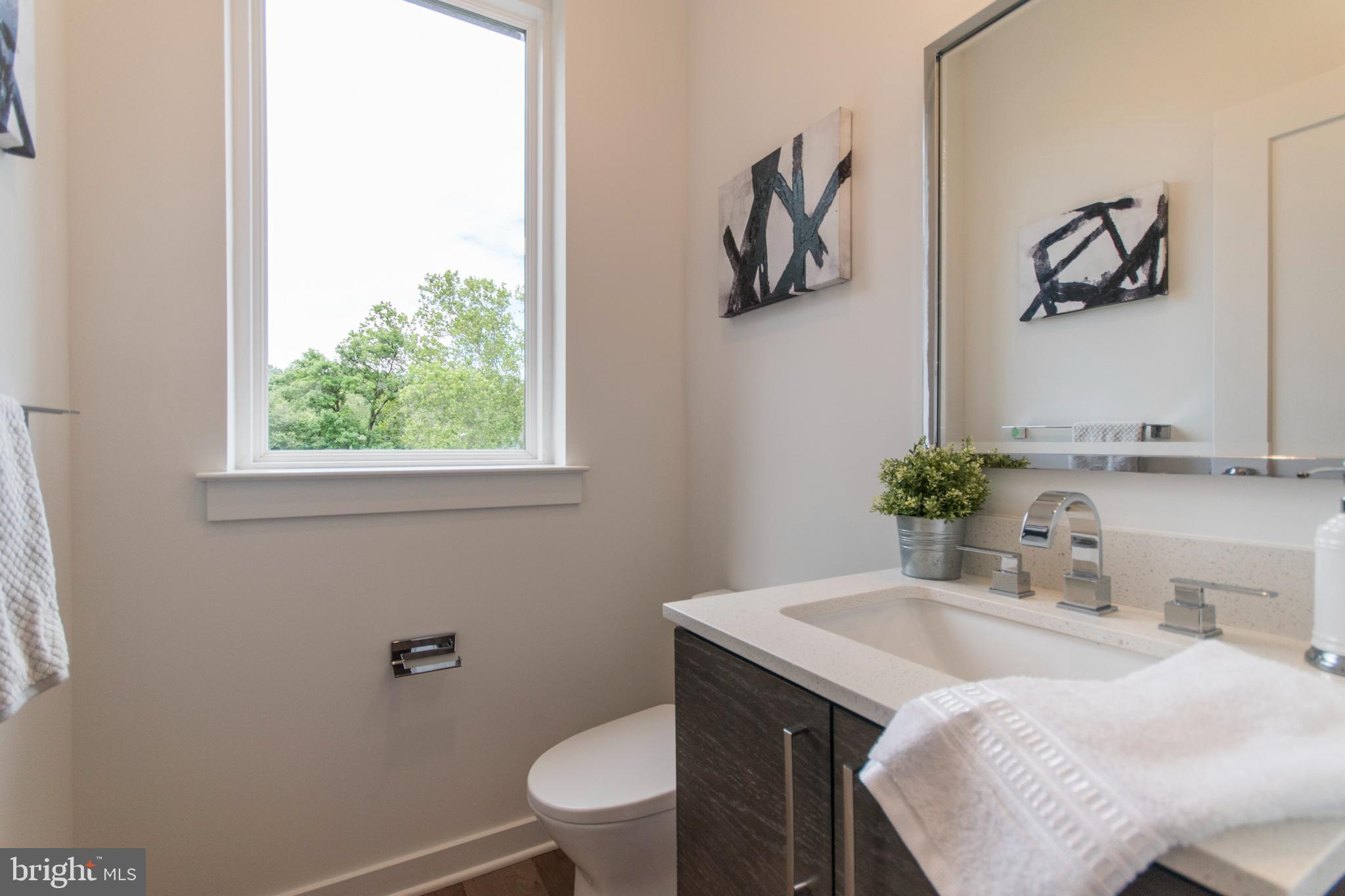 4443 River Ridge Court, Unit 13 Philadelphia, PA 19129 - Photo 12 of 35 a bathroom with a sink toilet and window
