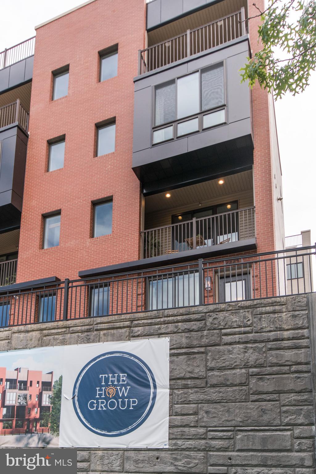 4443 River Ridge Court, Unit 13 Philadelphia, PA 19129 - Photo 2 of 35 a front view of a building with a street