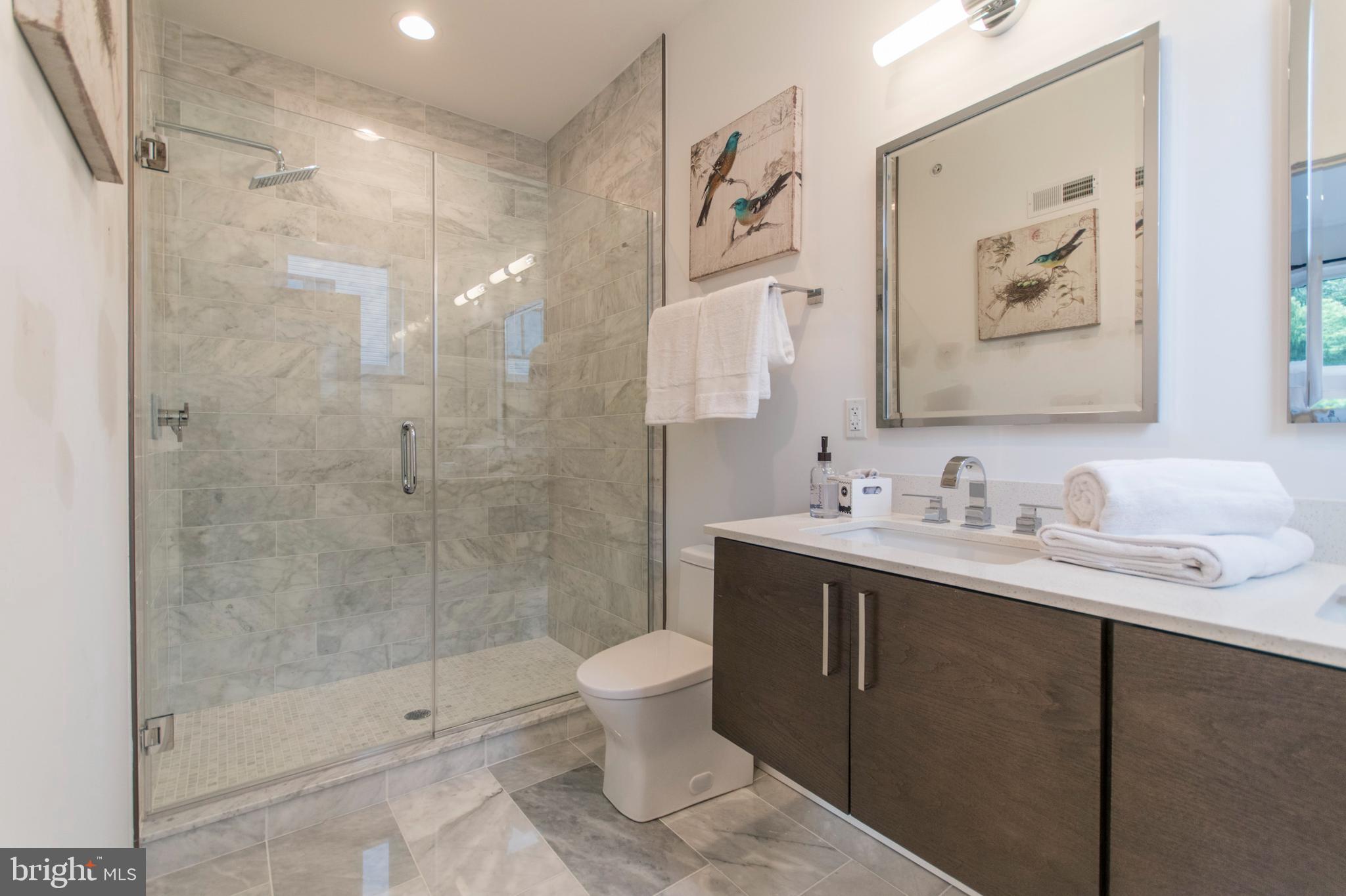 4443 River Ridge Court, Unit 13 Philadelphia, PA 19129 - Photo 22 of 35 a bathroom with a sink toilet and shower