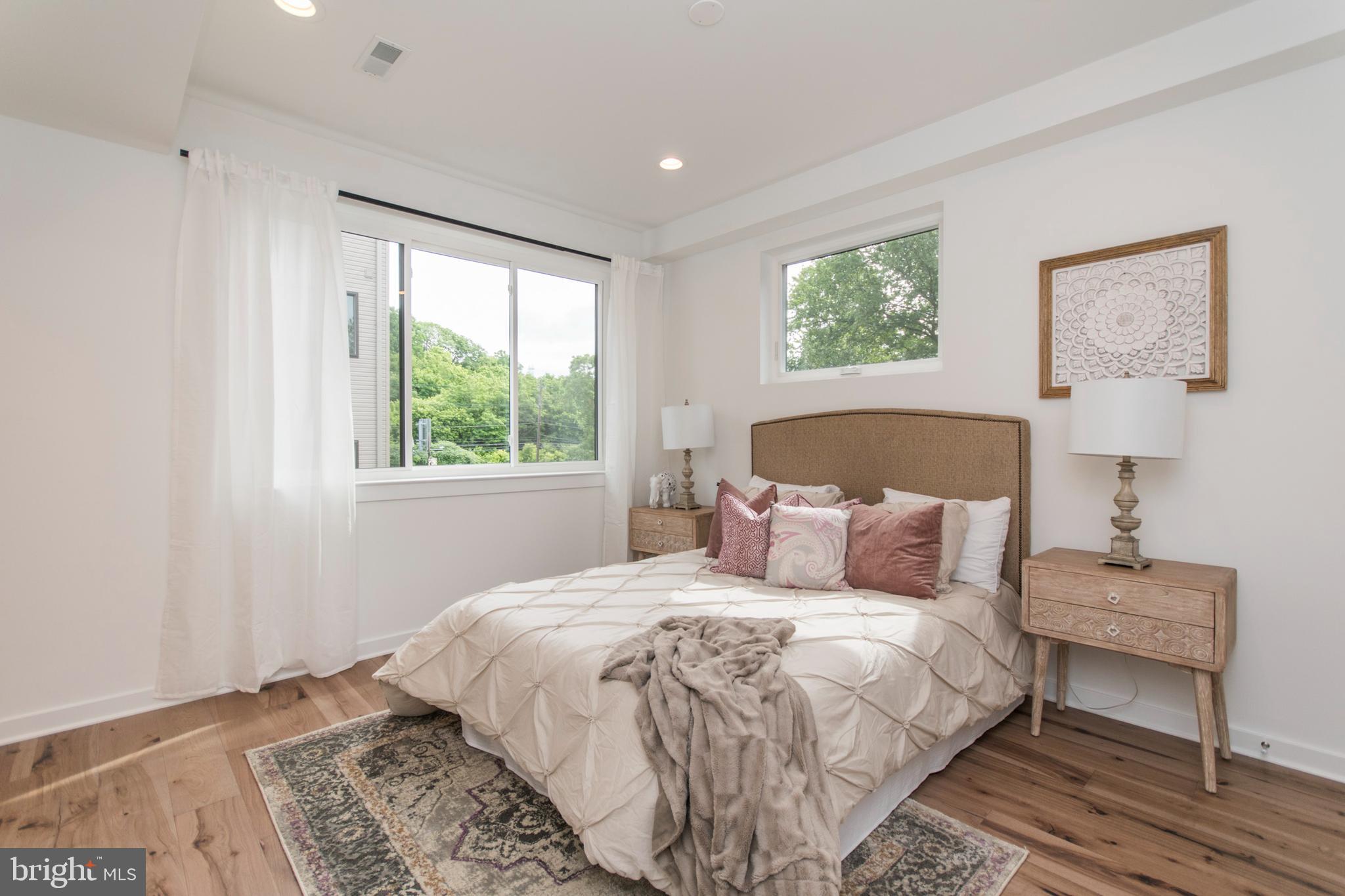 4443 River Ridge Court, Unit 13 Philadelphia, PA 19129 - Photo 30 of 35 a bedroom with a bed and a window