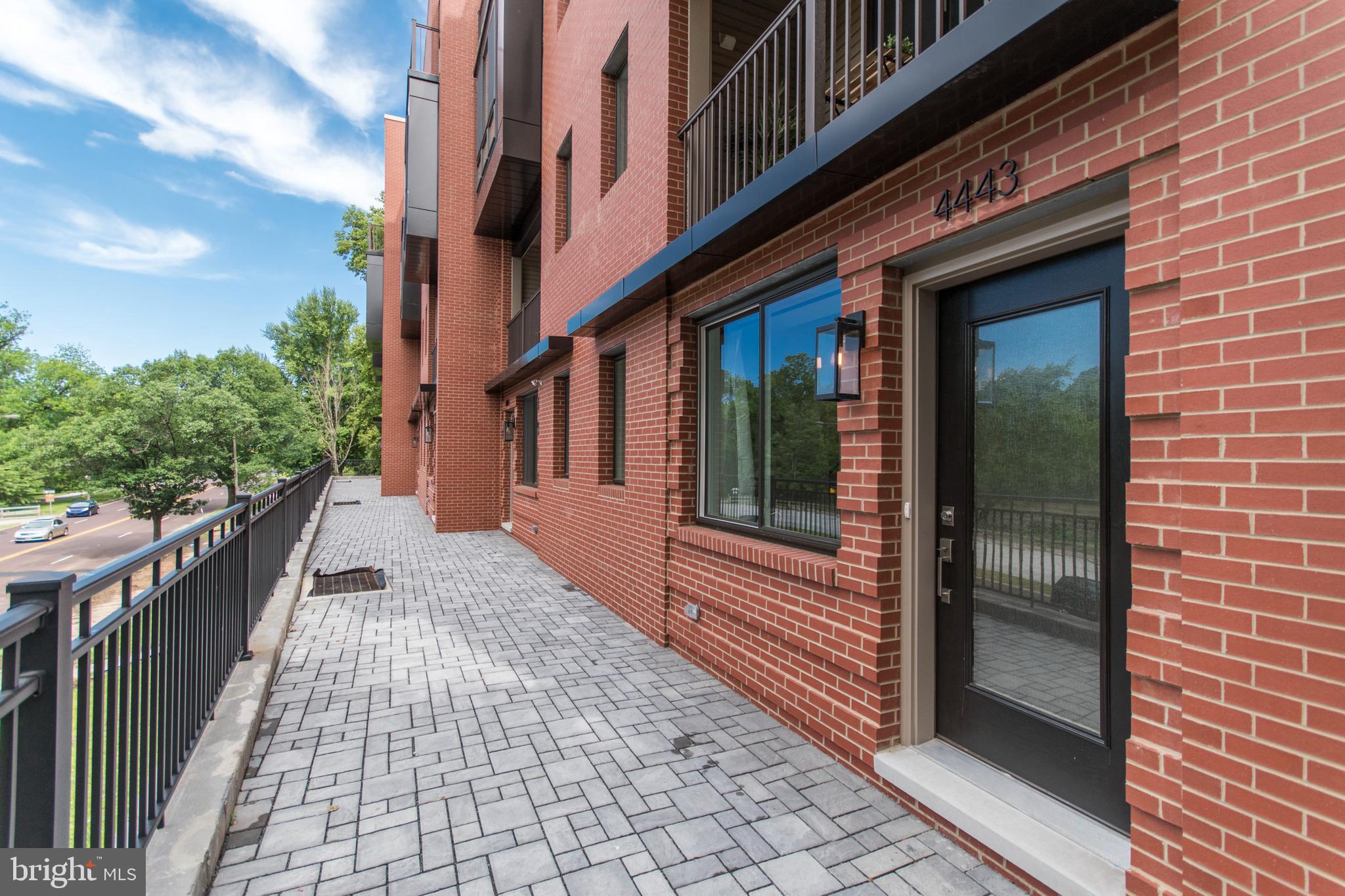 4443 River Ridge Court, Unit 13 Philadelphia, PA 19129 - Photo 3 of 35 a view of a brick house with a large windows