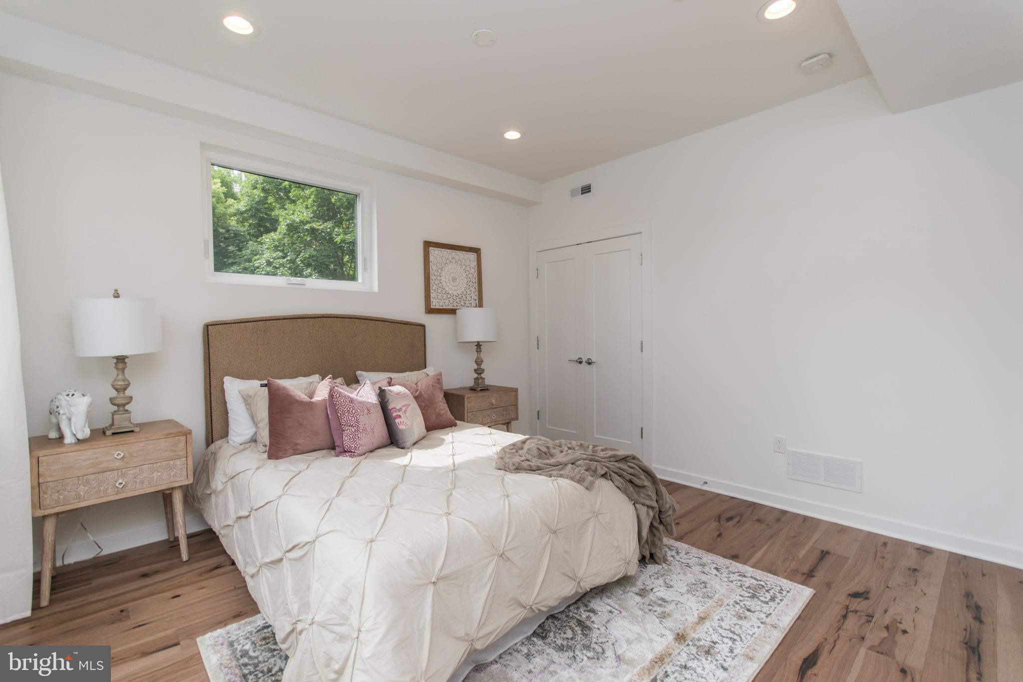 4443 River Ridge Court, Unit 13 Philadelphia, PA 19129 - Photo 31 of 35 a bedroom with a bed and a window